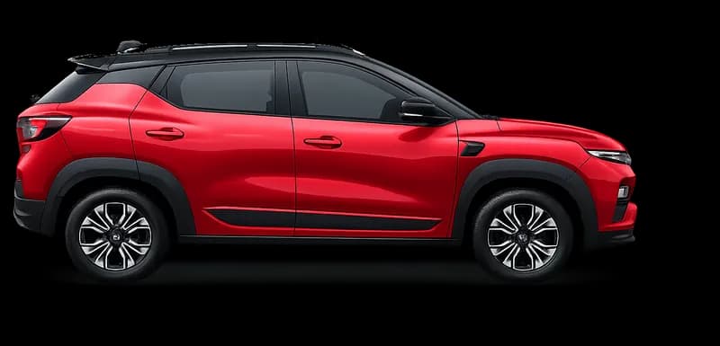 A Radiant Red Renault Kiger with a black roof, seen from the side